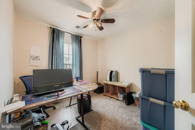 a workspace with furniture and a window