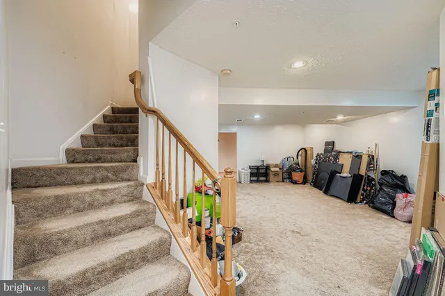 a view of a room with lots of gym equipment