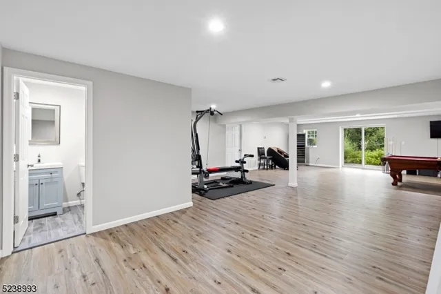 a view of a livingroom with furniture and a hardwood floor
