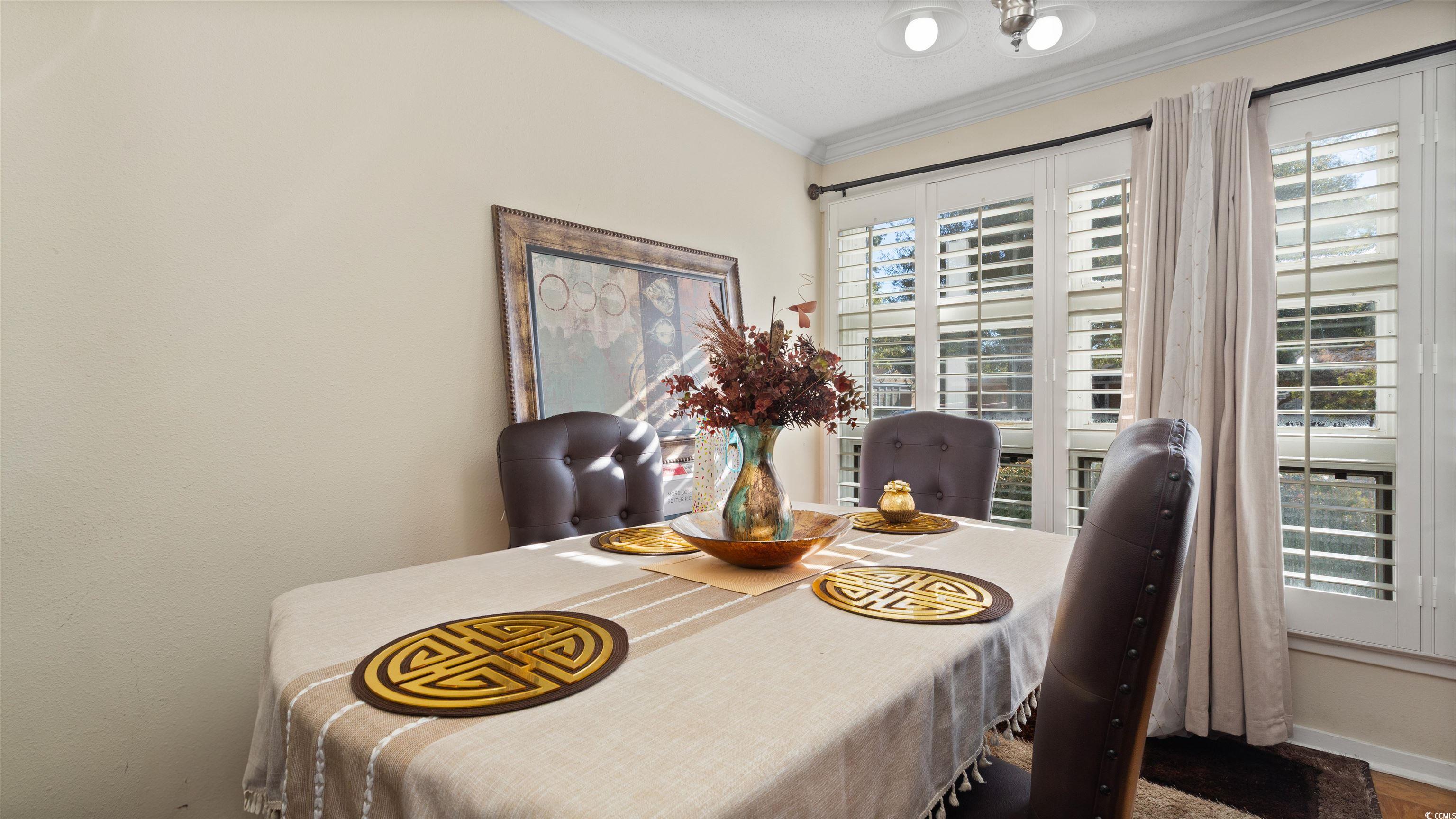 539 Redwood Avenue, Unit 539 Myrtle Beach, SC 29577 - Photo 13 of 23 Dining room with large windows and natural light