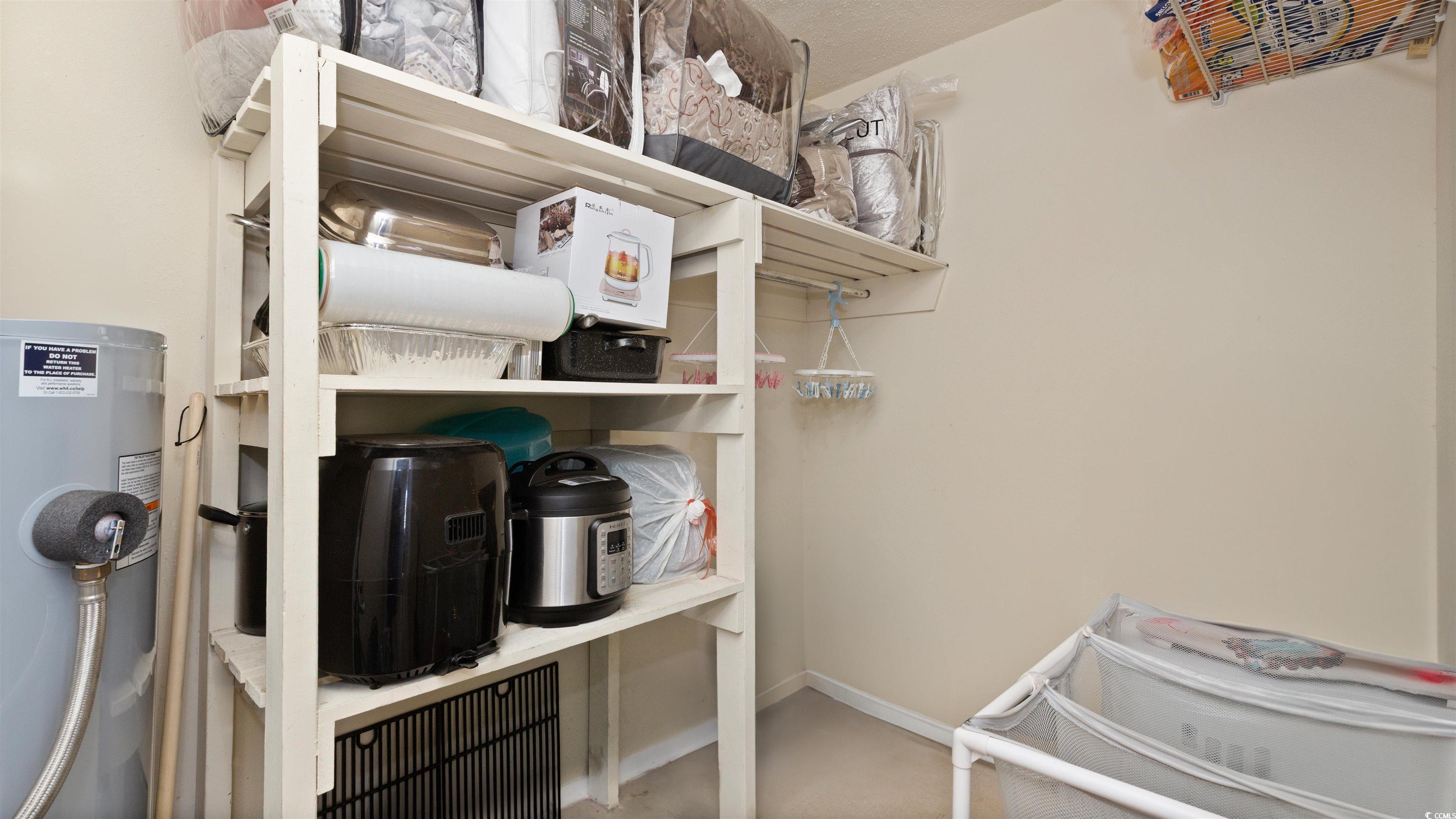 539 Redwood Avenue, Unit 539 Myrtle Beach, SC 29577 - Photo 15 of 23 Large storage closet with built in shelves and ample space for cleaning supplies, holidays and/or a pantry space. Water heater is located in the closet.