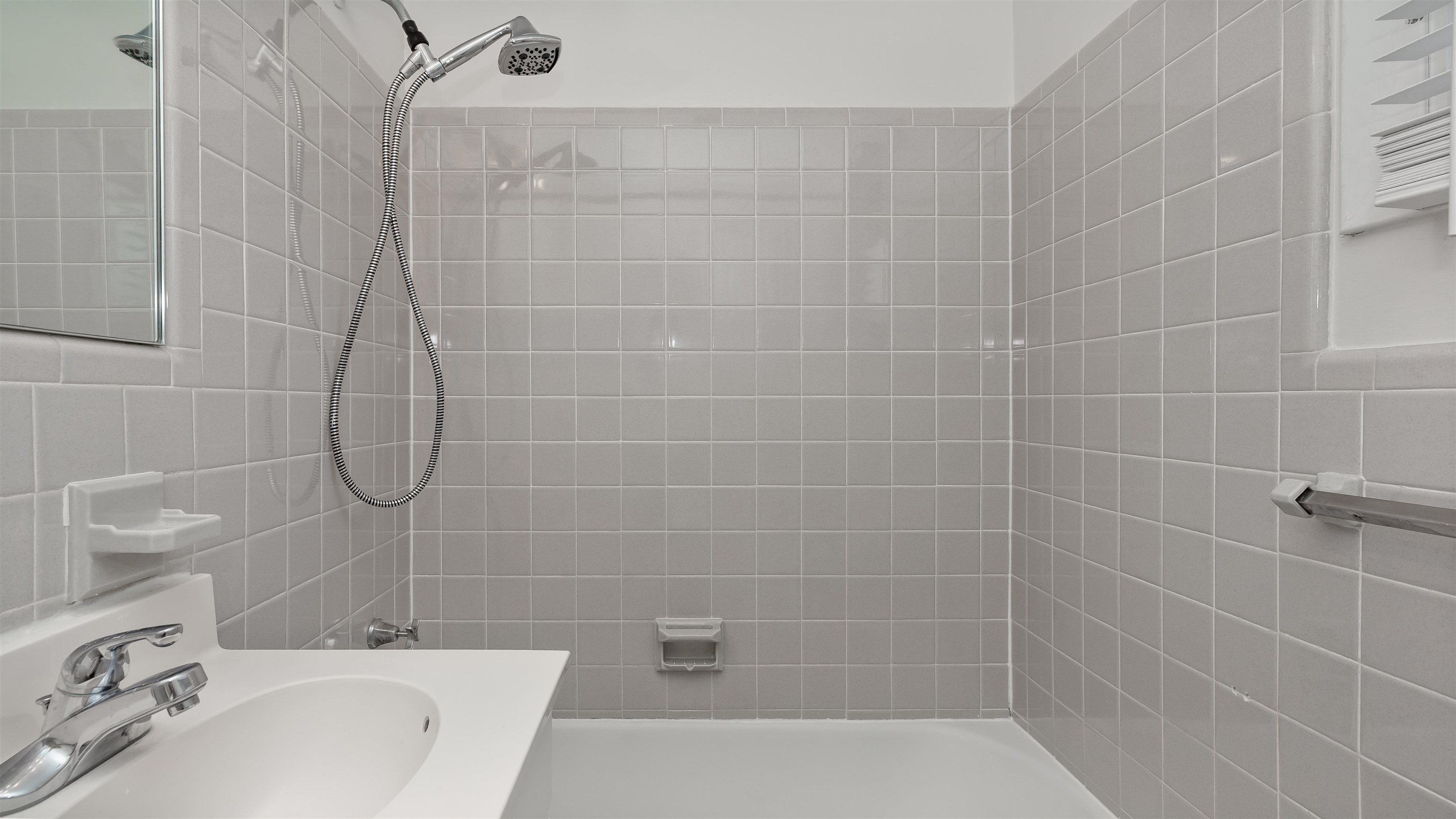 539 Redwood Avenue, Unit 539 Myrtle Beach, SC 29577 - Photo 18 of 42 Full bathroom featuring shower / washtub combination, vanity, and tile walls