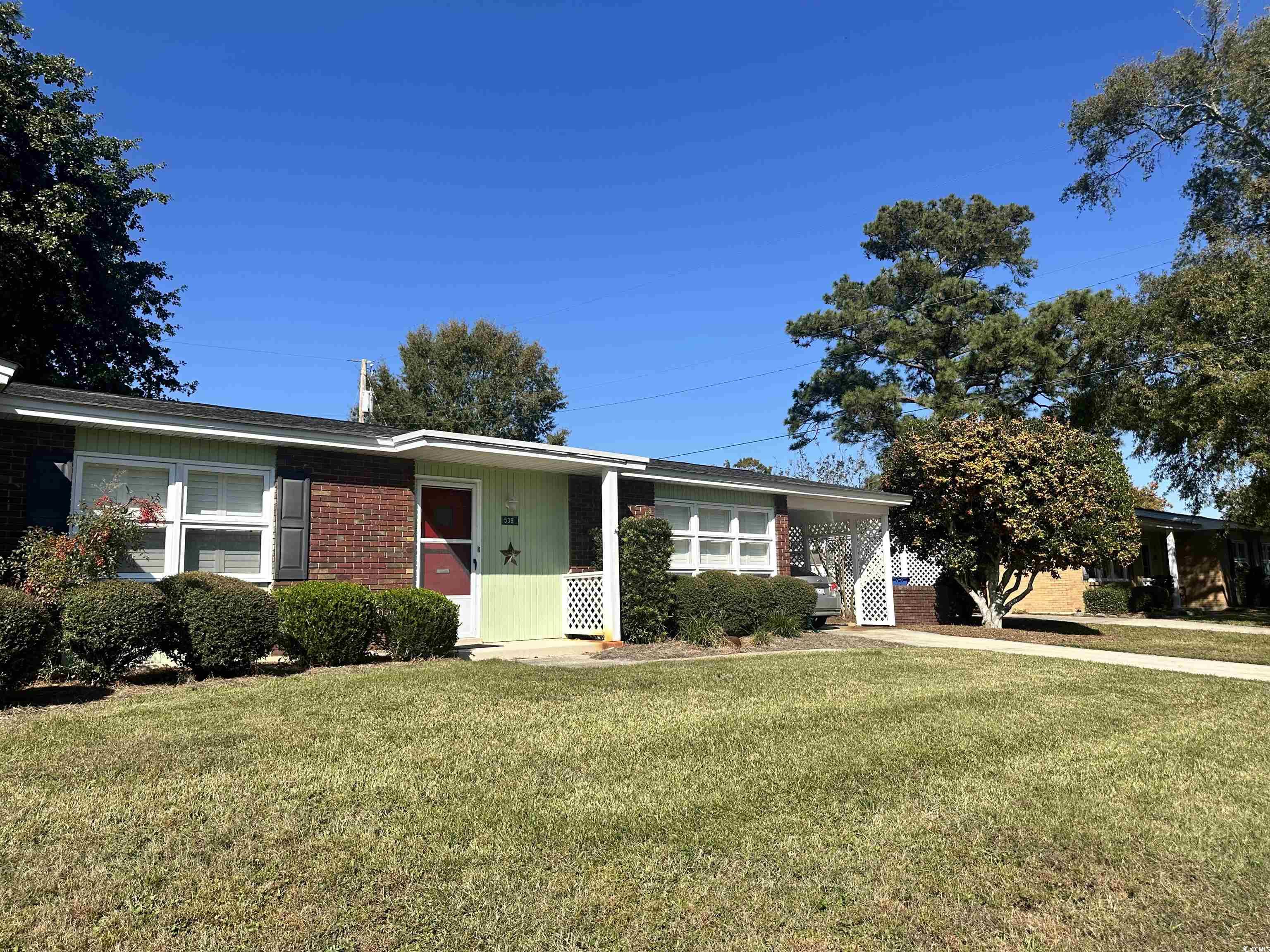539 Redwood Avenue, Unit 539 Myrtle Beach, SC 29577 - Photo 3 of 23 Ranch-style home with a front yard