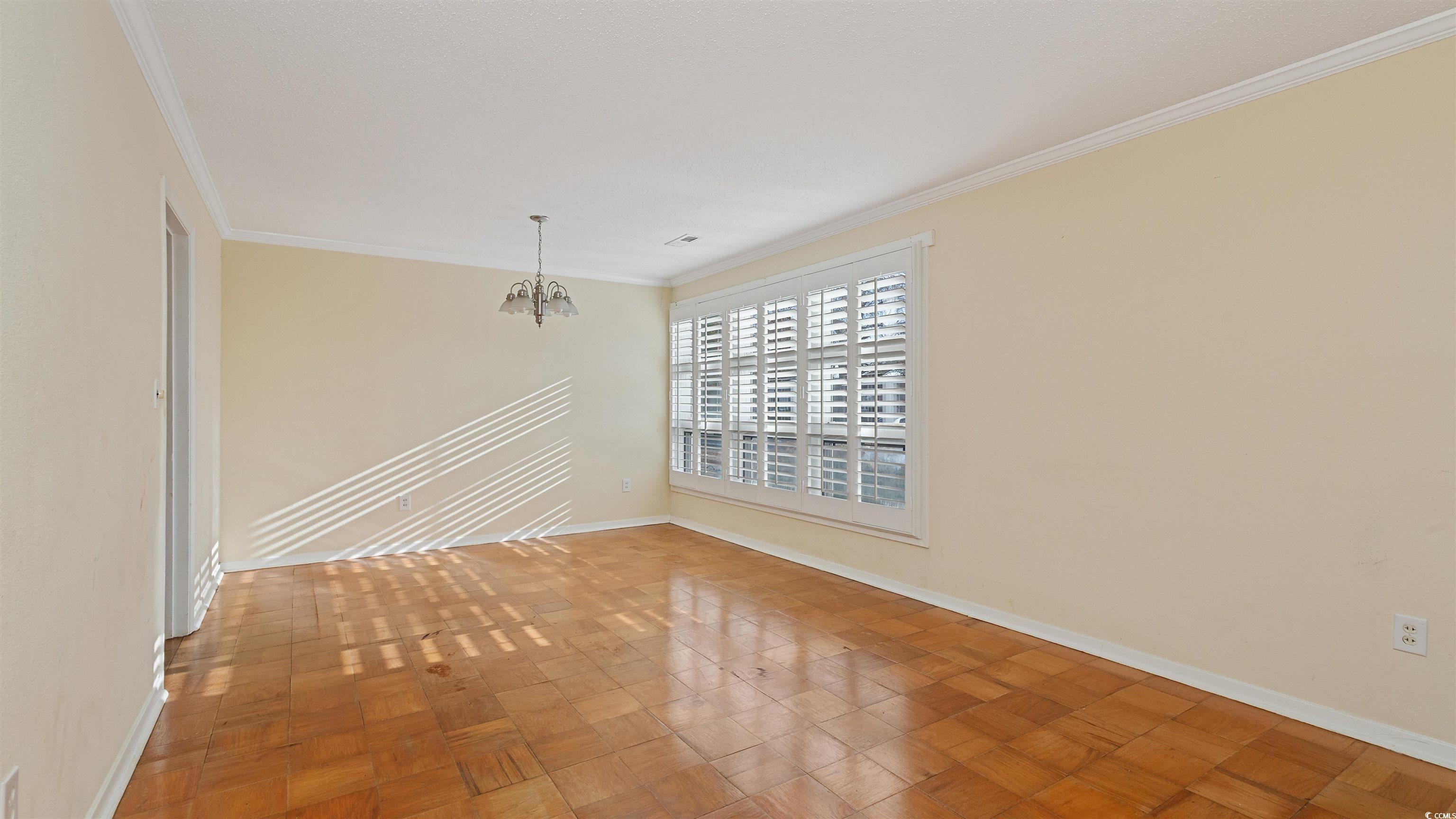 539 Redwood Avenue, Unit 539 Myrtle Beach, SC 29577 - Photo 7 of 42 Unfurnished dining area with large windows and natural light