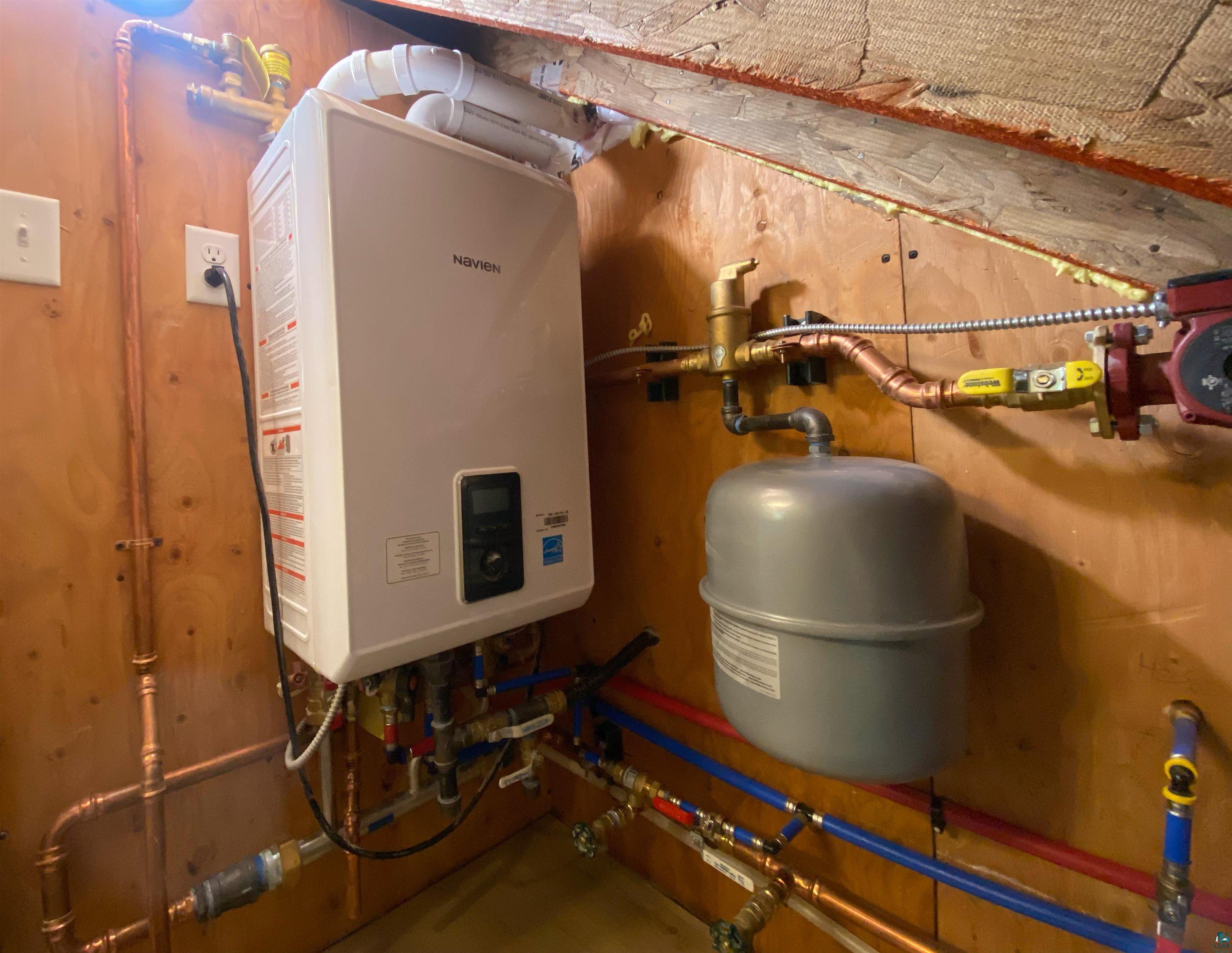 89180 Meadow Trail Cornucopia, WI 54827 - Photo 26 of 26 Utility room with tankless water heater