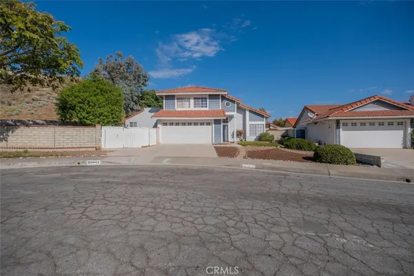 a view of a street with a building in the background