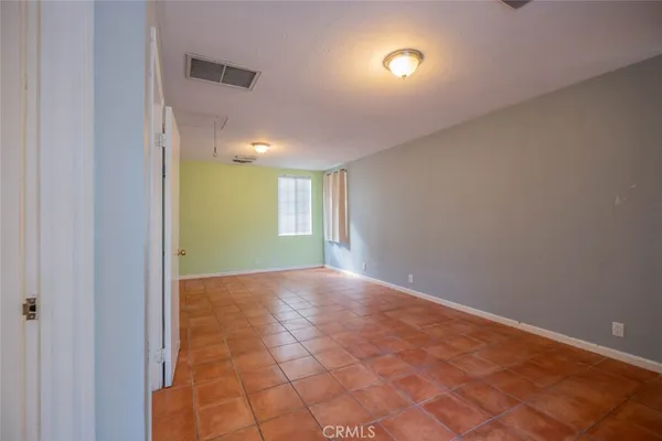 a view of an empty room and window