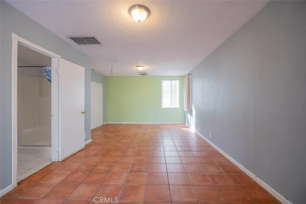 a view of an empty room and window