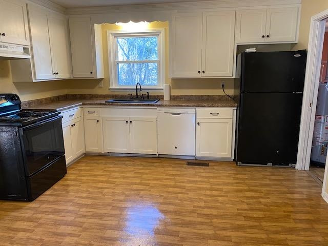 34 Baseline Road Dyer, TN 38330 - Photo 3 of 8 a kitchen with granite countertop a refrigerator stove and white cabinets