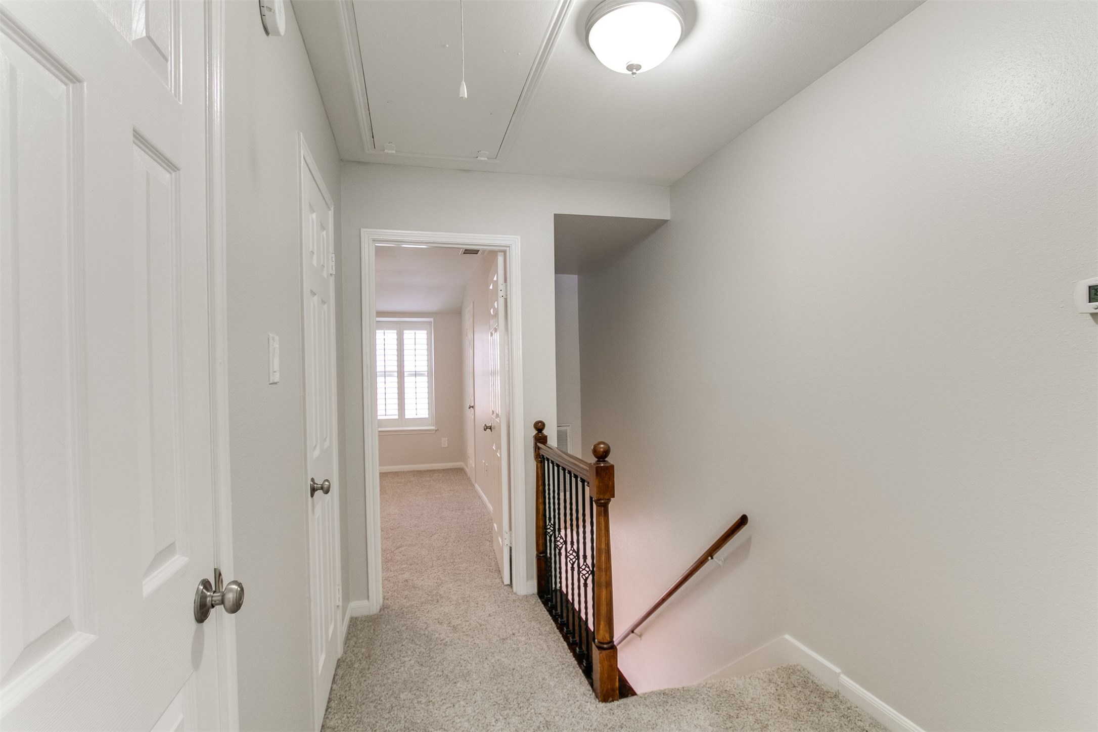 1407 Springrock Lane Houston, TX 77055 - Photo 9 of 25 Upstairs are two spacious bedrooms. The landing is home to great storage closets.