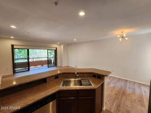 a kitchen that has a sink and a stove