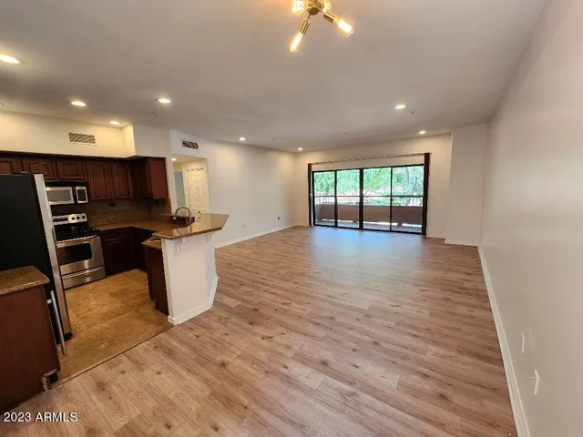 a view of a kitchen with microwave and cabinets
