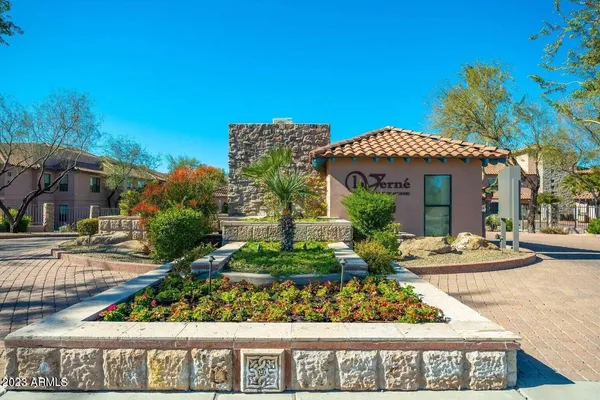 a front view of a house with lots of green space