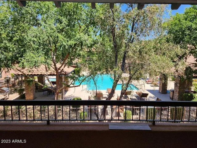 a view of lake with a large tree