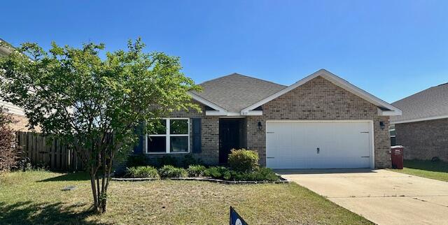 833 Moorhen Way Crestview, FL 32539 - Photo 1 of 18 a front view of a house with a yard
