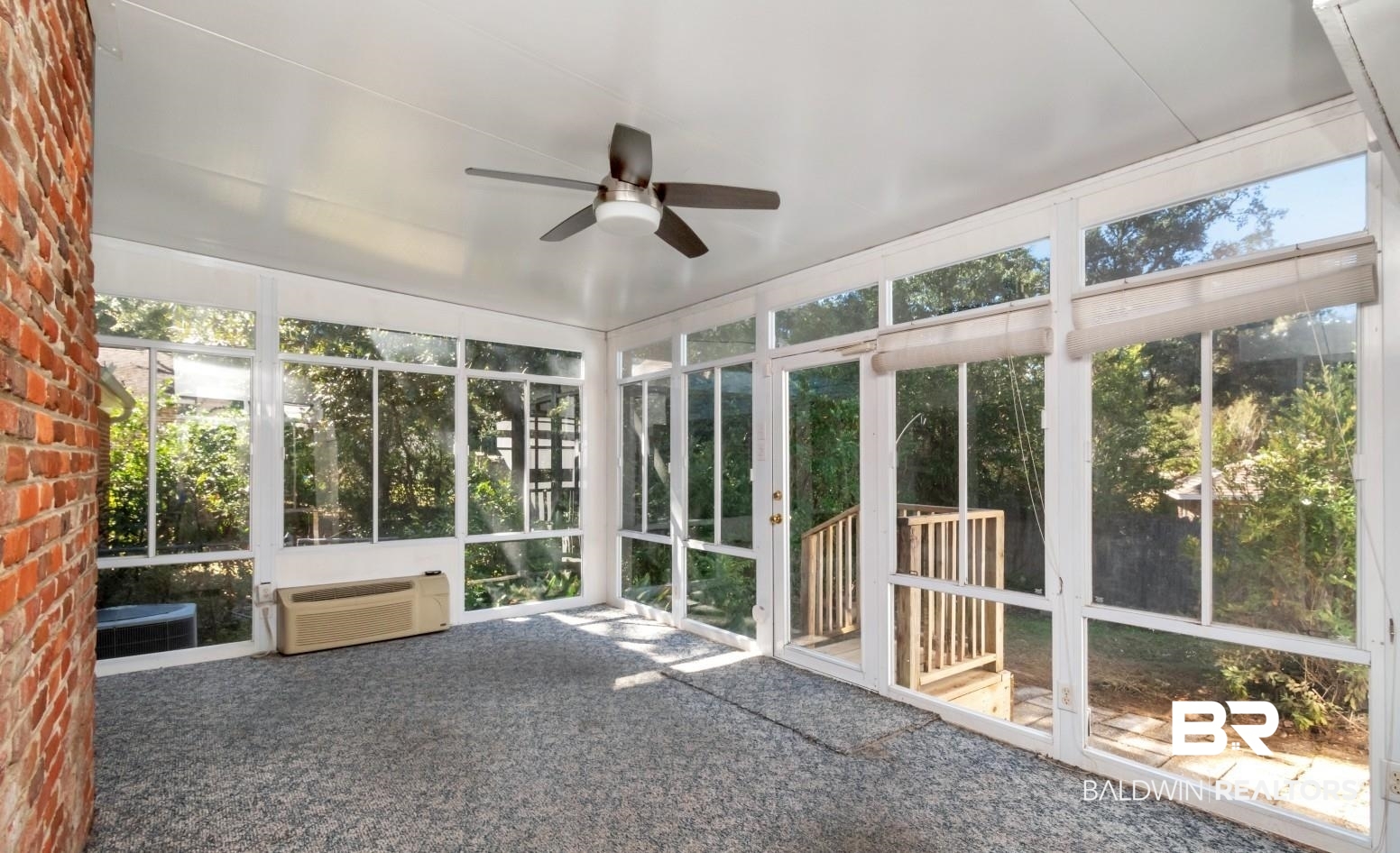 4543 Kingsway Drive Mobile, AL 36608 - Photo 8 of 28 Unfurnished sunroom with a ceiling fan and a wall mounted AC