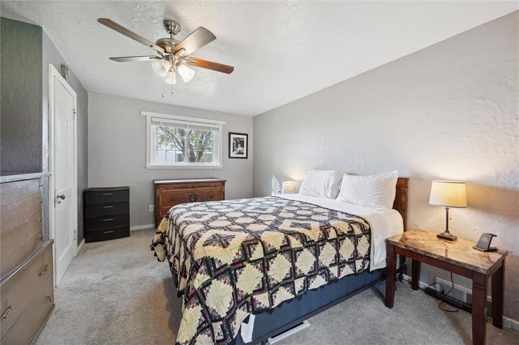 452 Airport Road Butler, PA 16002 - Photo 20 of 45 a bedroom with a bed and a chandelier