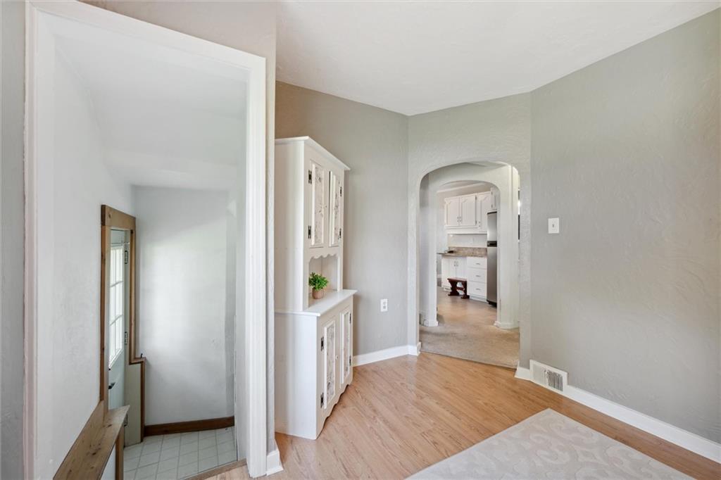 452 Airport Road Butler, PA 16002 - Photo 29 of 45 a view of a hallway view with wooden floor and a bathroom