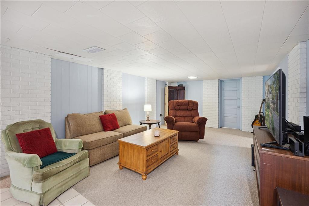 452 Airport Road Butler, PA 16002 - Photo 35 of 45 a living room with furniture and a flat screen tv