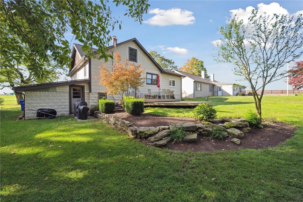 452 Airport Road Butler, PA 16002 - Photo 40 of 45 a front view of a house with garden and trees