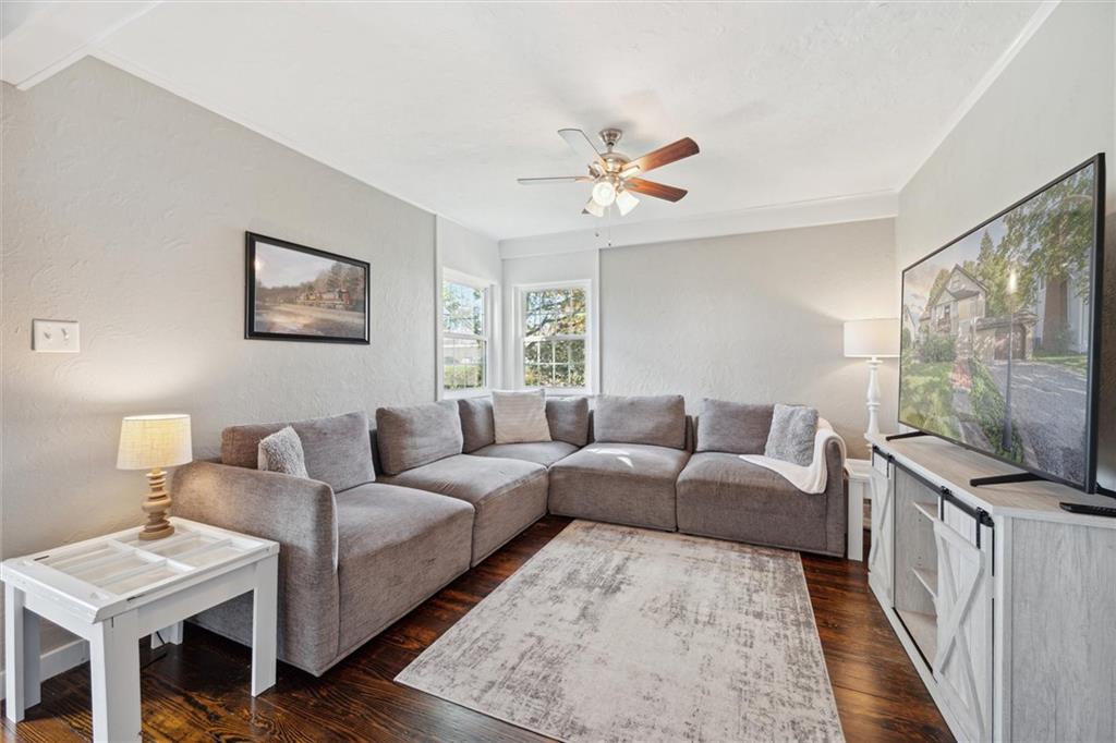 452 Airport Road Butler, PA 16002 - Photo 7 of 45 a living room with furniture a flat screen tv and a rug