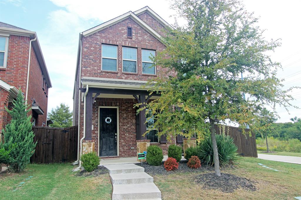 600 Ansley Way Allen, TX 75013 - Photo 1 of 1 a front view of a house with garden