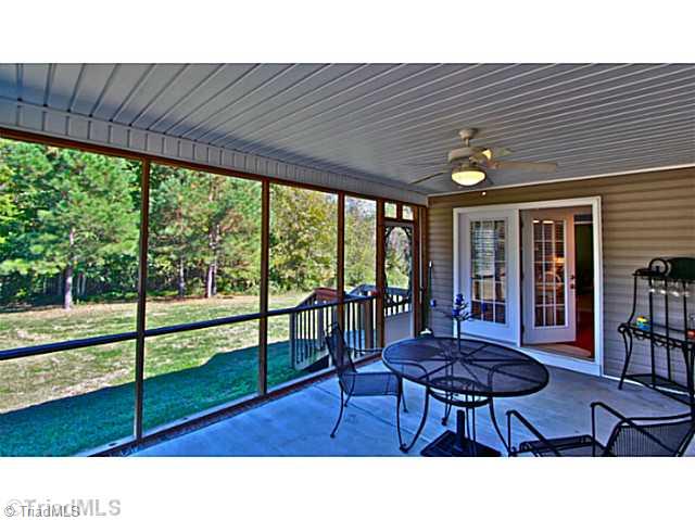 6891 Pritchett Road Browns Summit, NC 27214 - Photo 9 of 16 Screened Porch.