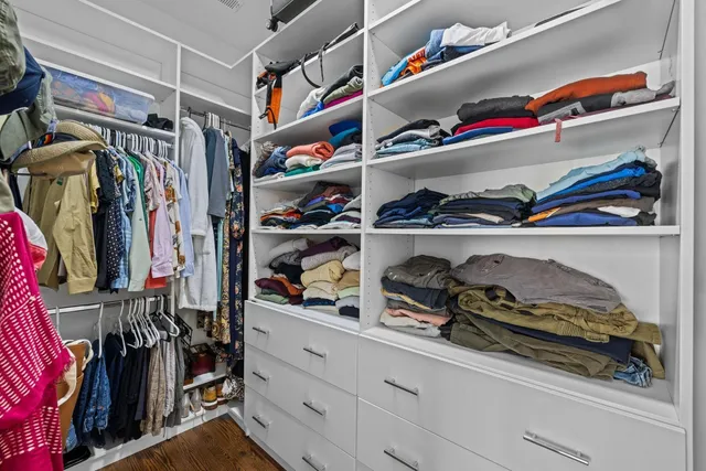 a bathroom with a double vanity sink a toilet and a mirror