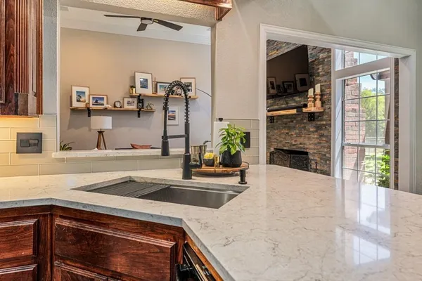 a kitchen with a sink and a refrigerator
