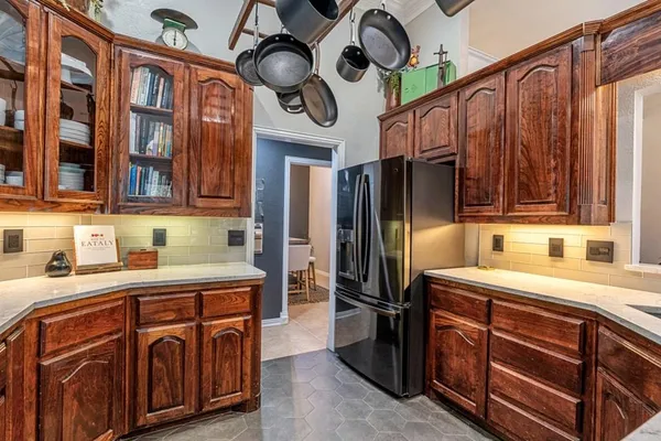 a kitchen with stainless steel appliances granite countertop a sink and dishwasher cabinets with wooden floor