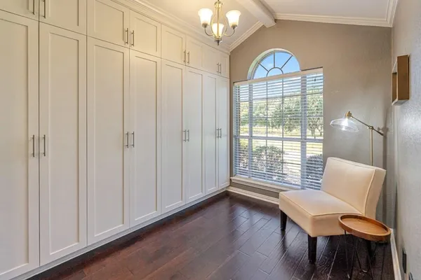 a view of a livingroom with furniture and a window