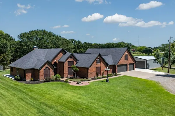 a aerial view of a house with swimming pool and garden