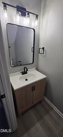 a bathroom with a sink and mirror
