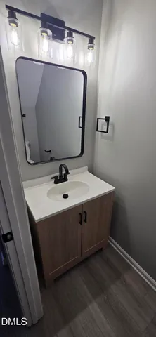 a bathroom with a sink and mirror