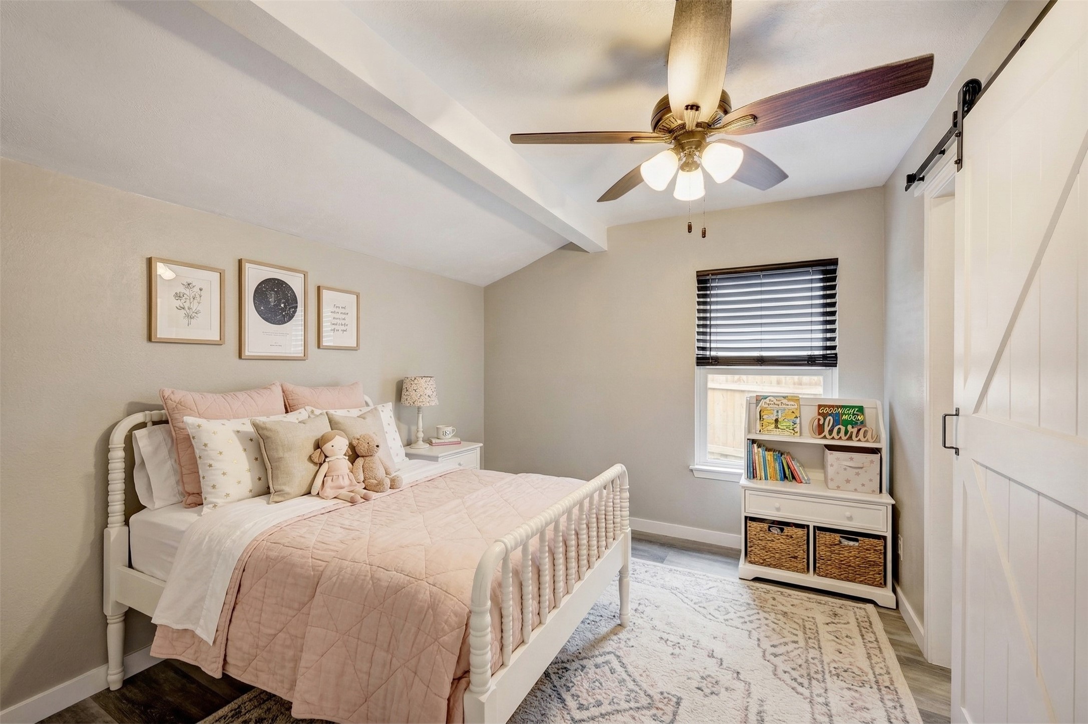 1911 North Red Cedar Circle Spring, TX 77380 - Photo 6 of 9 a bedroom with a bed and a chandelier