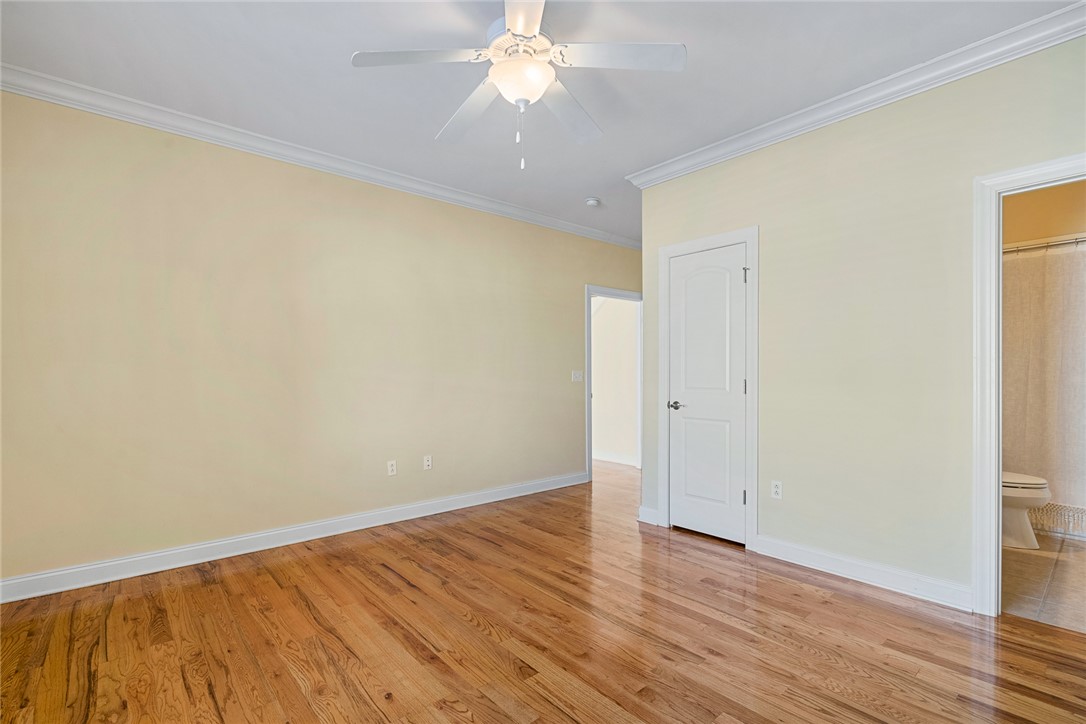 16 Oleander Drive Anderson, SC 29621 - Photo 29 of 37 Hardwood flooring and crown molding complement this generously proportioned room.