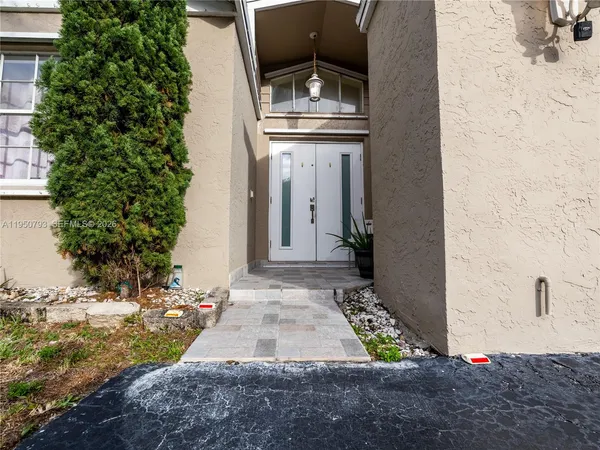 a front view of a house with yard