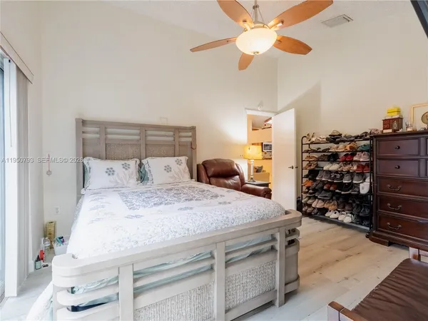 a view of a backyard with table and chairs under an umbrella