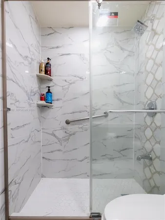 a view of a house with swimming pool and sitting area