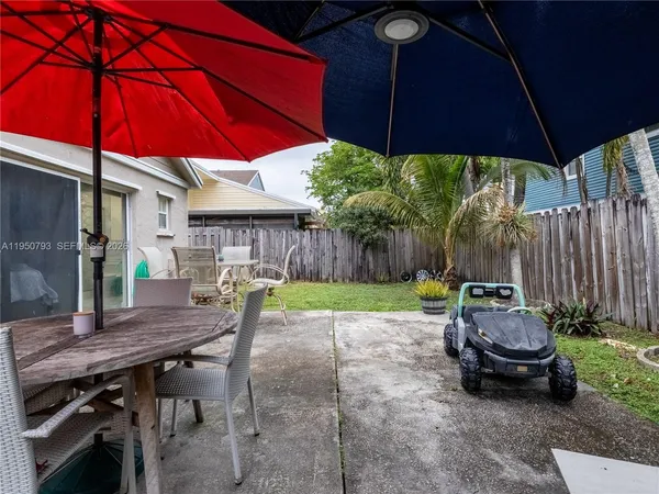 a view of a back yard from a balcony