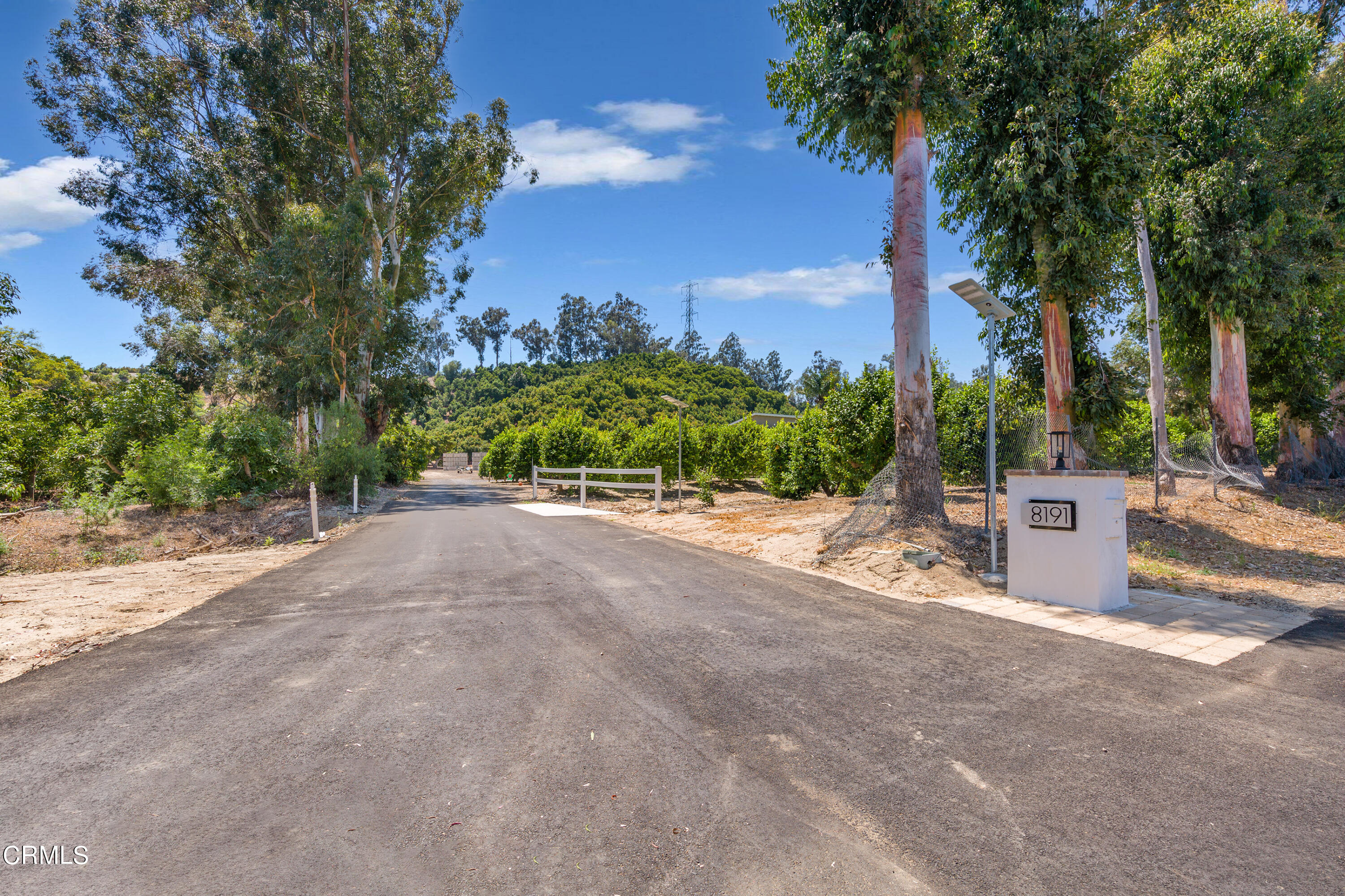 8191 Waters Road Moorpark, CA 93021 - Photo 2 of 13 a view of a garden with a building in the background