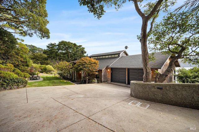 a view of balcony with wooden floor and outdoor seating