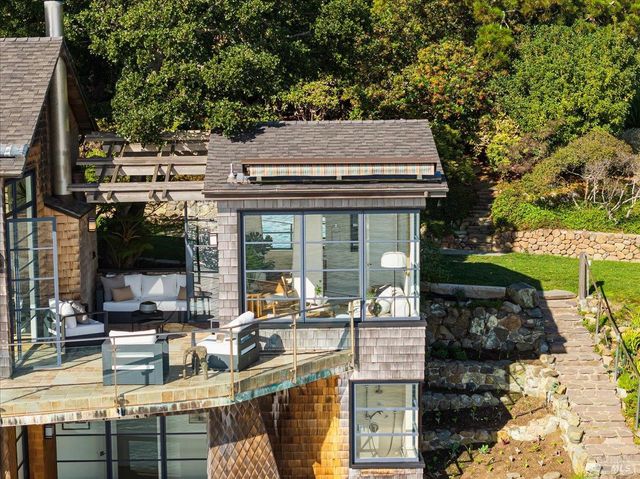 a bathroom with a sink a mirror and a shower