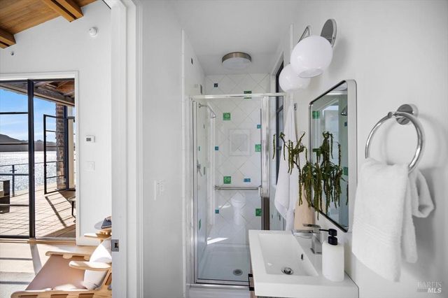 a living room with furniture and flowers