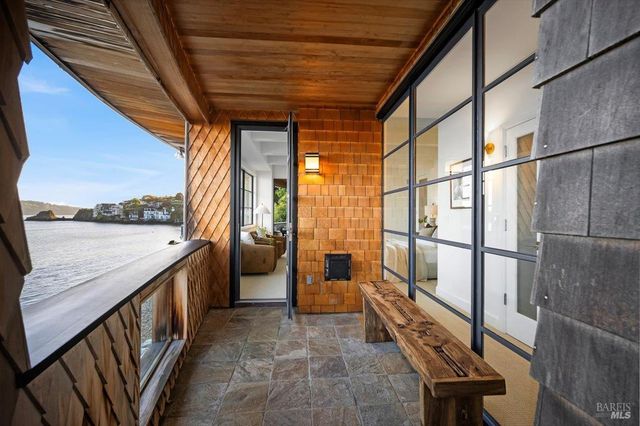 a bedroom with a bed and white walls