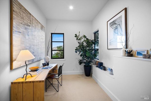 a bathroom with a tub a toilet and a shower