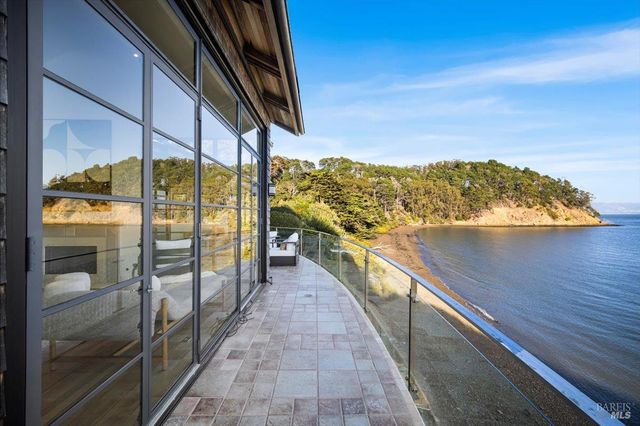 a bedroom with a bed mirror and window