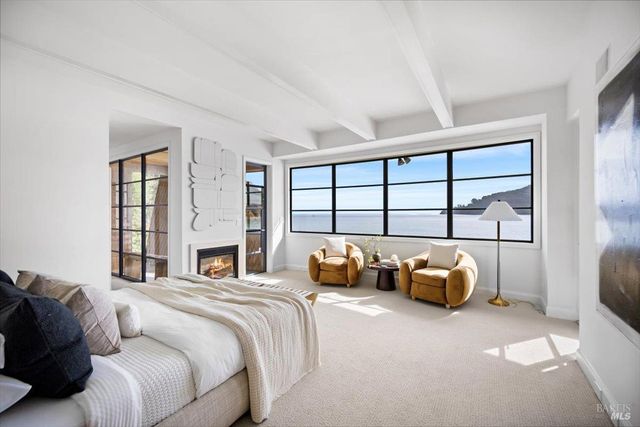 a narrow alley with a lake view