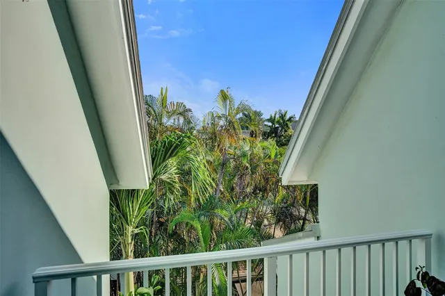 a bathroom with a granite countertop sink a toilet a mirror and bathtub