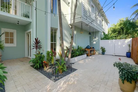 a view of a building along with potted plants